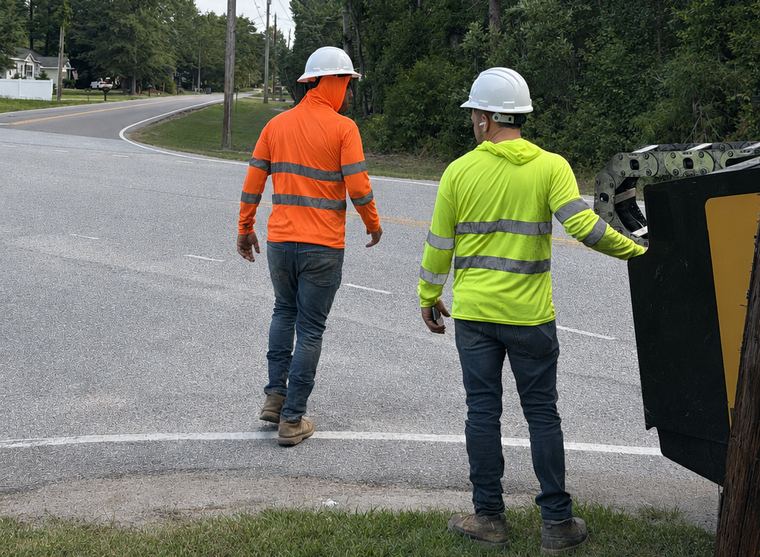 Crew setting up a road crossing